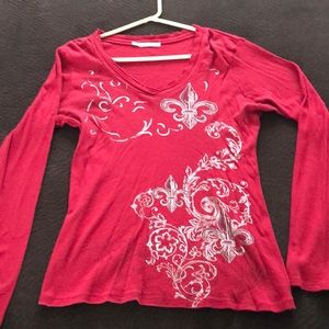 Red long sleeve fleur de lis print on front